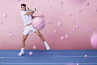 Carlos Alcaraz hitting pink tennis ball in evian promo
