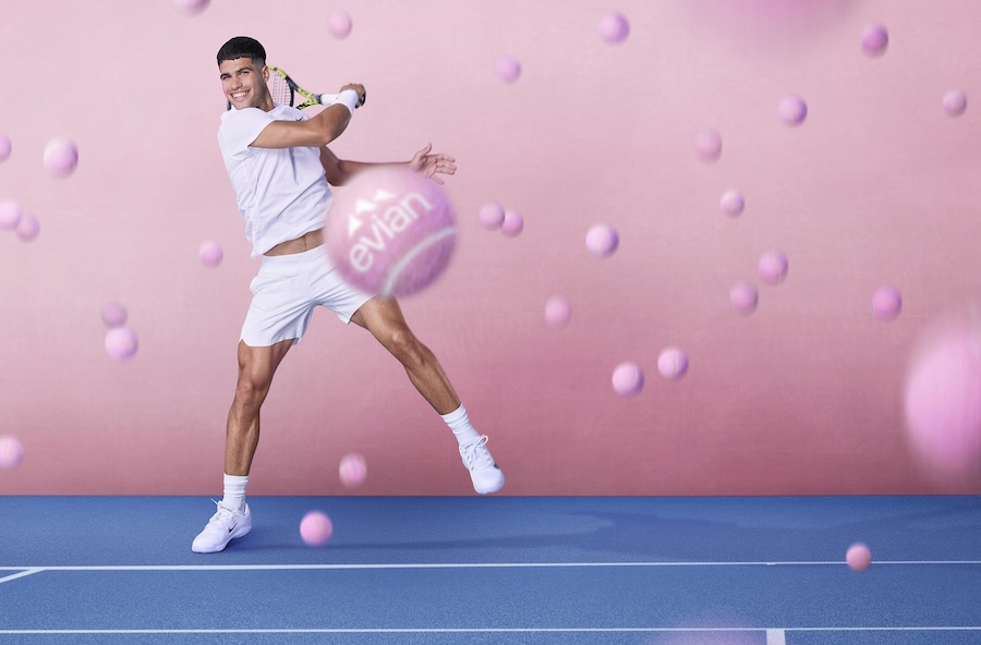 Carlos Alcaraz hitting pink tennis ball in evian promo