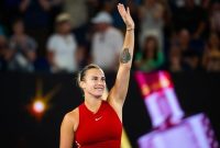 Tennis Star Aryna Sabalenka waiving to crowd after a match