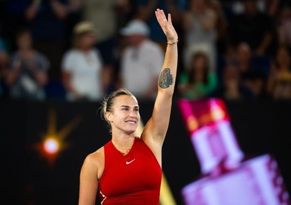 Tennis Star Aryna Sabalenka waiving to crowd after a match