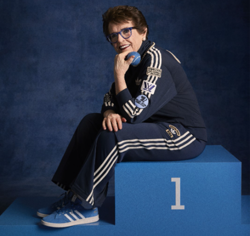 Billie Jean King posing in her classic blue suede shoes from adidas