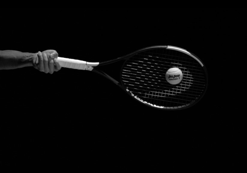 picture of new Pro Penn Marathon Plus ball hit by racquet